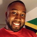 a man with a south african flag