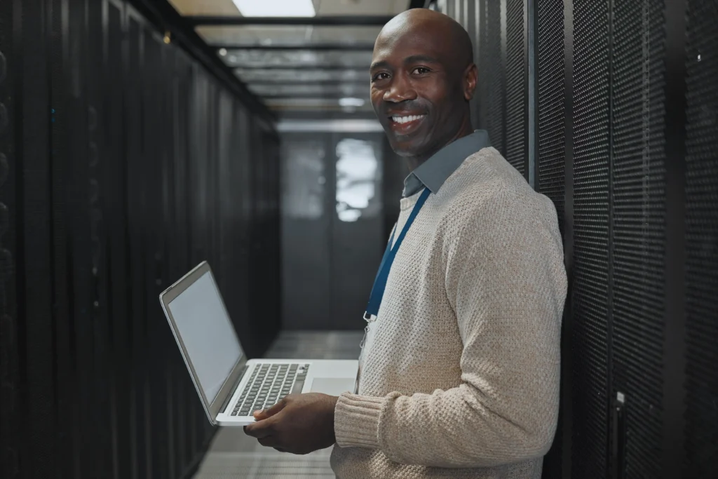 A Technical server expert smiling at the camera.