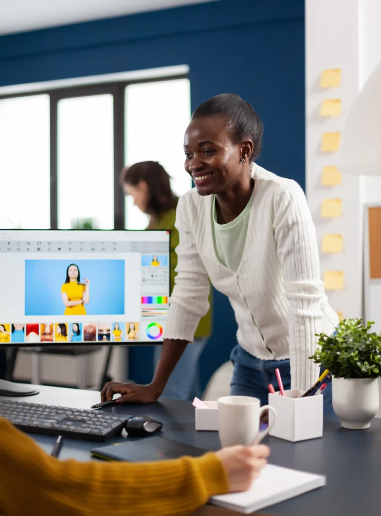 woman standing with screen behind her